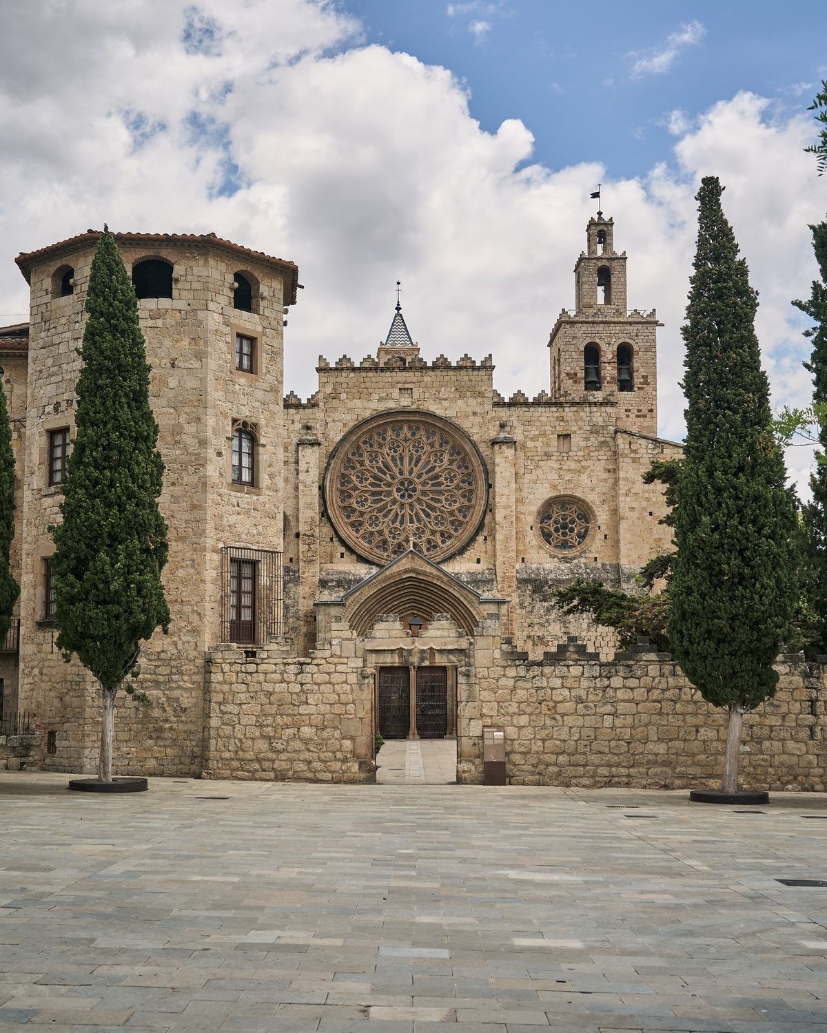 The Romanesque monastery of Sant Cugat del Vallès and its square